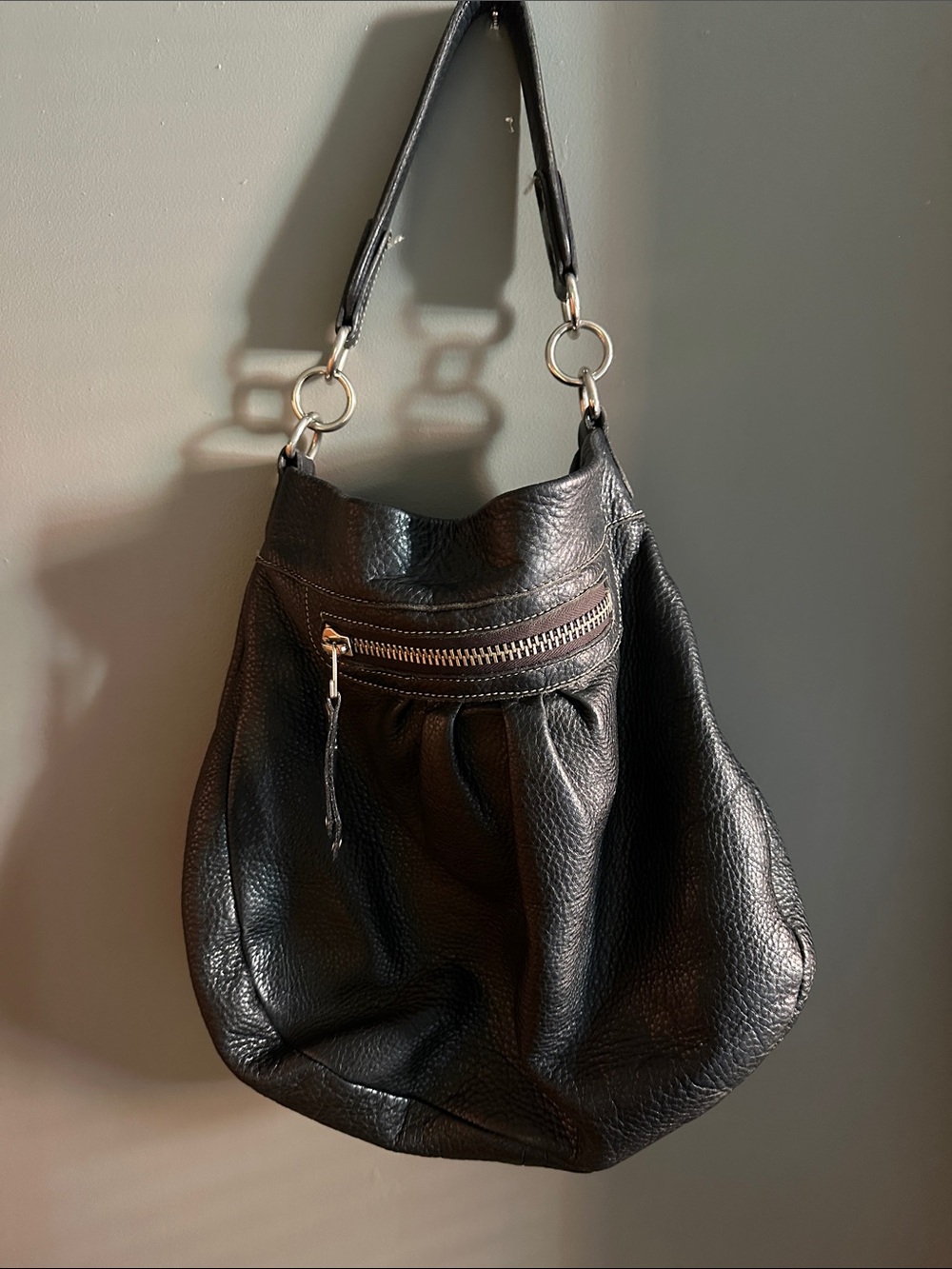 Roots Black Leather Hobo with Front Zip and Ring Accents